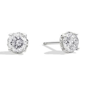 Anniversary, orecchini punto luce in oro bianco 18 Kt e diamante taglio brillante Ct. 0,35