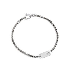 Bracciale in titanio con piastrina
e moschettone in oro bianco
con incisione maschietto